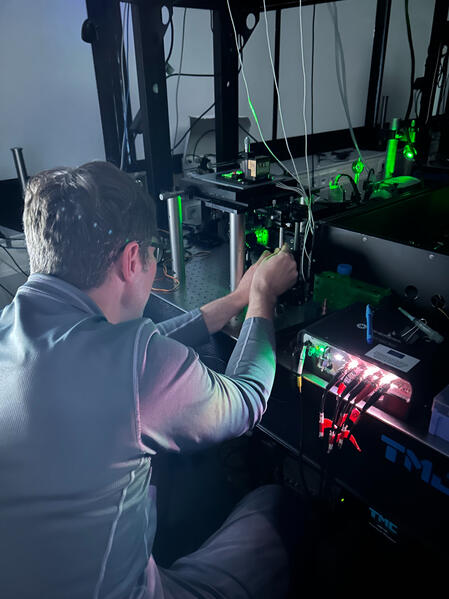 Karl rebuilding a TIRF microscope